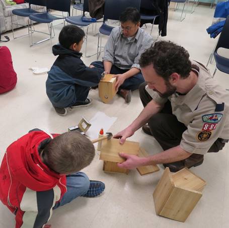 scouts and leaders assembling birdhouses